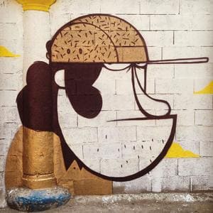 Graffiti créatif intégrant un tuyau comme cigare