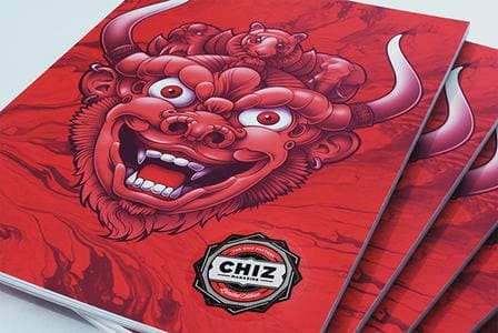 Magazines avec illustration de monstre rouge et logo 'CHIZ'